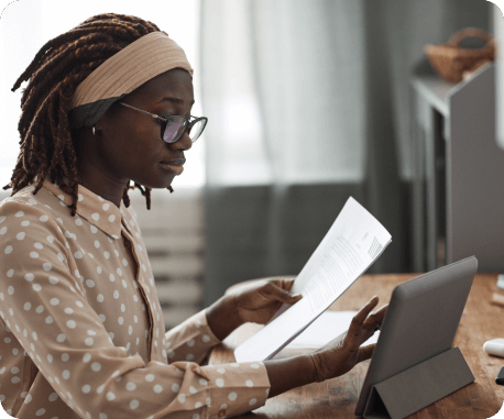 Happy businesswoman with tablet